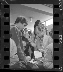 Group of students writing in notebooks during sit-in