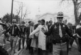 Thomas Reed and others marching toward the Capitol in Montgomery, Alabama, to attempt to remove the Confederate flag from atop the dome.