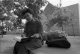 A sudent studies outside the Haggerty Art Museum, 1989