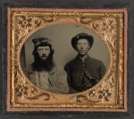 [Unidentified soldier in Union uniform and unidentified man with full beard in fur hat]