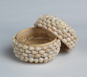 Ceremonial basket adorned with cowrie shells