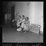 Thumbnail for Three CORE hunger strikers sitting in hallway at Los Angeles Board of Education Building, 1963