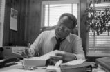 Alex Haley: Seated at desk (AHP 1-79-11 #63)