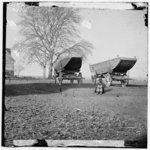 [Dutch Gap, Virginia (vicinity). Pontoon boats on wheeled carriages at deserted farm house near Dutch Gap canal]