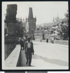 Mr. Robinson walks across the Karlovy Bridge, circa 1950, Prague