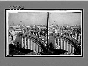 Looking S.E. through the swinging colonade [colonnade] of the Varried Industries Building. 5862 Interpositive