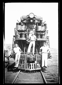 Three men on a locomotive] [black-and-white cellulose acetate photonegative