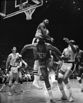 Wilt Chamberlain jumping near a hoop, Los Angeles, ca. 1970