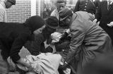 People assisting Amelia Boynton after she was beaten and gassed by state troopers on Bloody Sunday in Selma, Alabama.