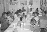 Children saying prayers before lunch at the Children's Hope Center at 487 South Jackson Street in Montgomery, Alabama.