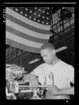 Production. Aircraft engines. A skilled mechanic and determined war worker, Zed W. Robinson, proves that skin pigment bears no relation to efficiency of work. He's one of many Negroes employed in a large Midwest aircraft plant in skilled and semi-skilled capacity. Tightening bolts of a cylinder barrel during the final build-up of an airplane engine is one of the jobs which, until fairly recently, was closed to members of his race. But this war demands that no American because of race, creed or color shall be barred from work. Melrose Park, Buick plant