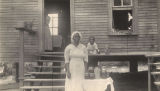 African American woman with jars of preserves.