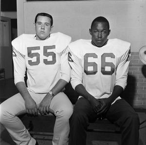 Two football players with shoulder pads, 4