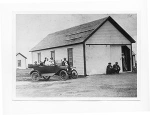 Portrait of People Sitting in a Car and Standing in a Building