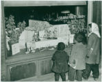 Children looking at the window display in the Asheville Colored Public Library