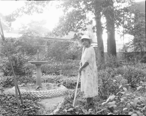 Dr. Anna J. Cooper in her garden, home & patio [acetate film photonegative]