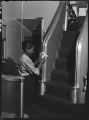 Worker polishing handrail in Vista-Dome of Zephyr coach, 14th Street passenger yards, Chicago, May 1948