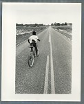 Young boy bicycling