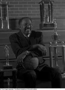 Photograph of coach Marion Tawrice Jones and basketball trophies #3