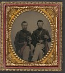 [Two unidentified soldiers in Union captain's uniform and lieutenant's uniform, holding foot officers' swords, wearing frock coats, over-the-shoulder belt for sword attachment, and red sashes]