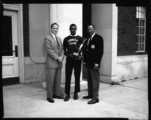 H.U. [Howard University] Crew, Coaches and Captain with trophy, May 1964 [cellulose acetate photonegative]