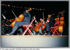 Thumbnail for Photograph of cellists playing their instruments