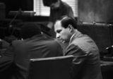 Anthony Ray Hinton conferring with his lawyer, Sheldon Perhacs, during his capital murder trial in Birmingham, Alabama.