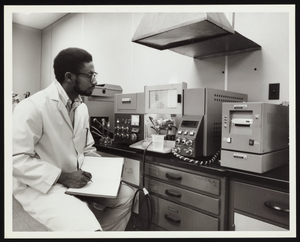 Chemist using Perkin-Elmer instruments at Detroit Edison Company laboratory