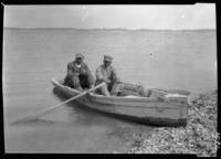 Oyster men in boat at English fort