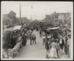 Assembly Street and Gervais Street looking north, trucks and cars, DeSoto Hotel, and two African American boys in middle, 1934