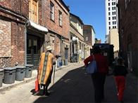 Vaughnette Goode-Walker leading her Footprints of Savannah walking tour through Bay Lane