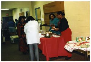 Joan Duncan and Links Members at Food Table During Christmas Party