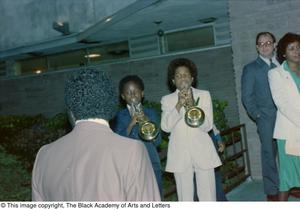 Photograph of two young boy playing the trumpet