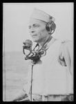 U.S. Negro troops on way to Liberia. Captain W.D. Nabors stands on the bridge of a transport bearing a U.S. Army Engineer detachment made up chiefly of Negroes of Liberia, Africa. Captain Nabors served in the cavalry as a trooper, attended Officer Training School in 1917, served in France in 1918 and then spent five years as a member of the American military mission to Liberia, part of the time as commandant of the Liberian Frontier Force. Later, in 1936 he became senior instructor and military advisor to this force until his recall by the U.S. Army