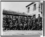 [Group portrait of armed Greek male and female guerrilla fighters]