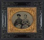 [Unidentified soldier in Union uniform and hat and unidentified woman in patterned dress]