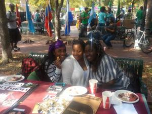 Three women eating at carnaval