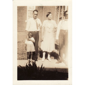 Reverend Dr. Wm. Frederick Fisher poses with a family