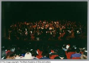 Photograph of a choir, and an orchestra ensemble