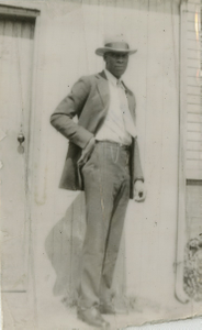 Young Howard Brown standing on doorstep