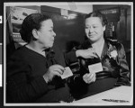 Charlotta Bass and Mrs. Pearl Bailey with pins and membership cards, circa 1941/1950, Los Angeles