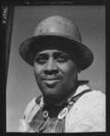 Tennessee Valley Authority (TVA). Construction of Douglas Dam. Negro worker at the TVA's new Douglas Dam on the French Broad River. This dam will be 161 feet high and 1,682 feet long, with a 31,600 acre reservoir area extending forty-three miles upstream. With a useful storage capacity of approximatley 1,330,000 acre-feet, this reservoir will make possible the addition of nearly 100,000 kilowatts of continuous power to the TVA's system in dry years and almost 170,000 kilowatts in the average year