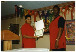 Woman in Red Presenting Achievement Award