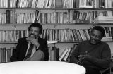 Arnold Mitchem and Arthur Mayberry laugh during a meeting in the director's office, 1984