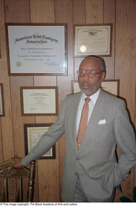 Louis A. Bedford posing with his law credentials