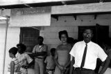 Dan Houser and others, standing on the porch of the Autauga County Improvement Association office in Prattville, Alabama.