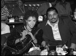 Melba Moore sitting at a table with an unidentified man at the Pied Piper nightclub, Los Angeles, 1983