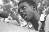 Stokely Carmichael addressing a crowd in front of the state capitol in Jackson, Mississippi, at the end of the "March Against Fear" begun by James Meredith.