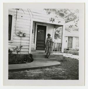 S. A. Winn Standing on a Porch