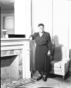 Mrs. Mary McLeod Bethune standing near fireplace : acetate film photonegative